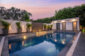 StayVista's The Secret Lagoon with Outdoor Pool, Verdant Lawn & Indoor-Outdoor Activities